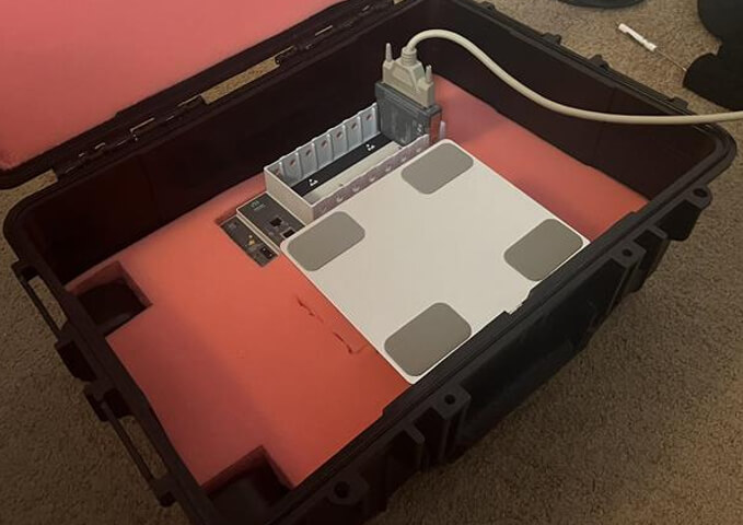 Prototype layout of the clamshell case with the foam to house all the components. The cDAQ is meant to relocate to the expandable platform when in-use to prevent overheating.